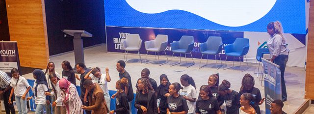 Youth financial literacy stage session with facilitators and participants at a Digital Economy Africa event